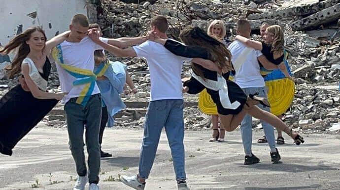 School graduates dance sombre waltz on ruins of House of Arts in Kharkiv Oblast