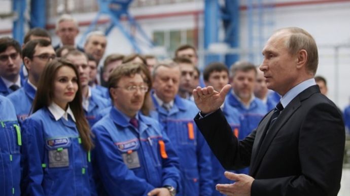 Putin tells Russian workers they are making more missiles than US