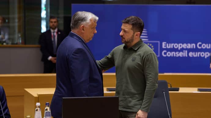 Orbán and Zelenskyy have charged conversation on sidelines of EU summit after shaking hands – video