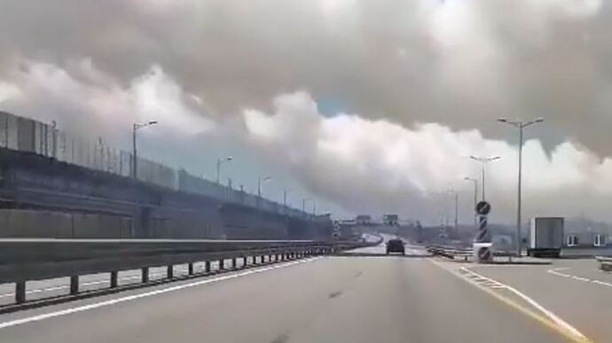 Invaders train to defend the Crimean Bridge, amid clouds of smoke