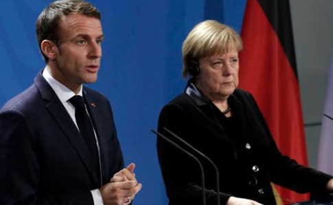 Меркель і Макрон: обмін полоненими має допомогти відновити довіру між сторонами