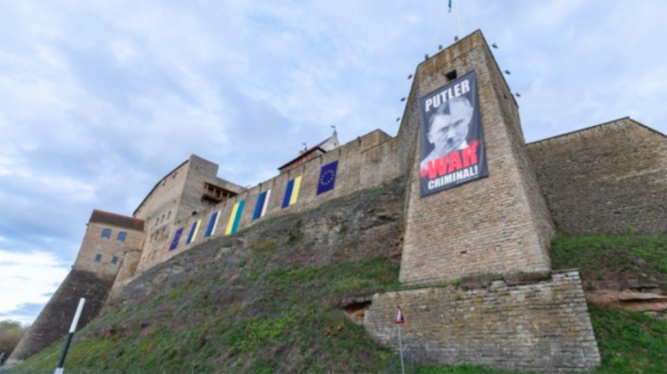 Banner mocking Putin as "Putler" displayed at Estonia-Russia border on Russia's Victory Day
