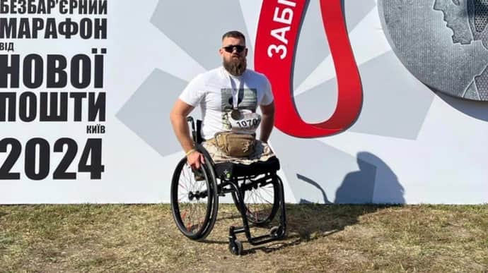 Ukrainian veteran completes wheelchair race after serious injury to honour his friend's memory – photos