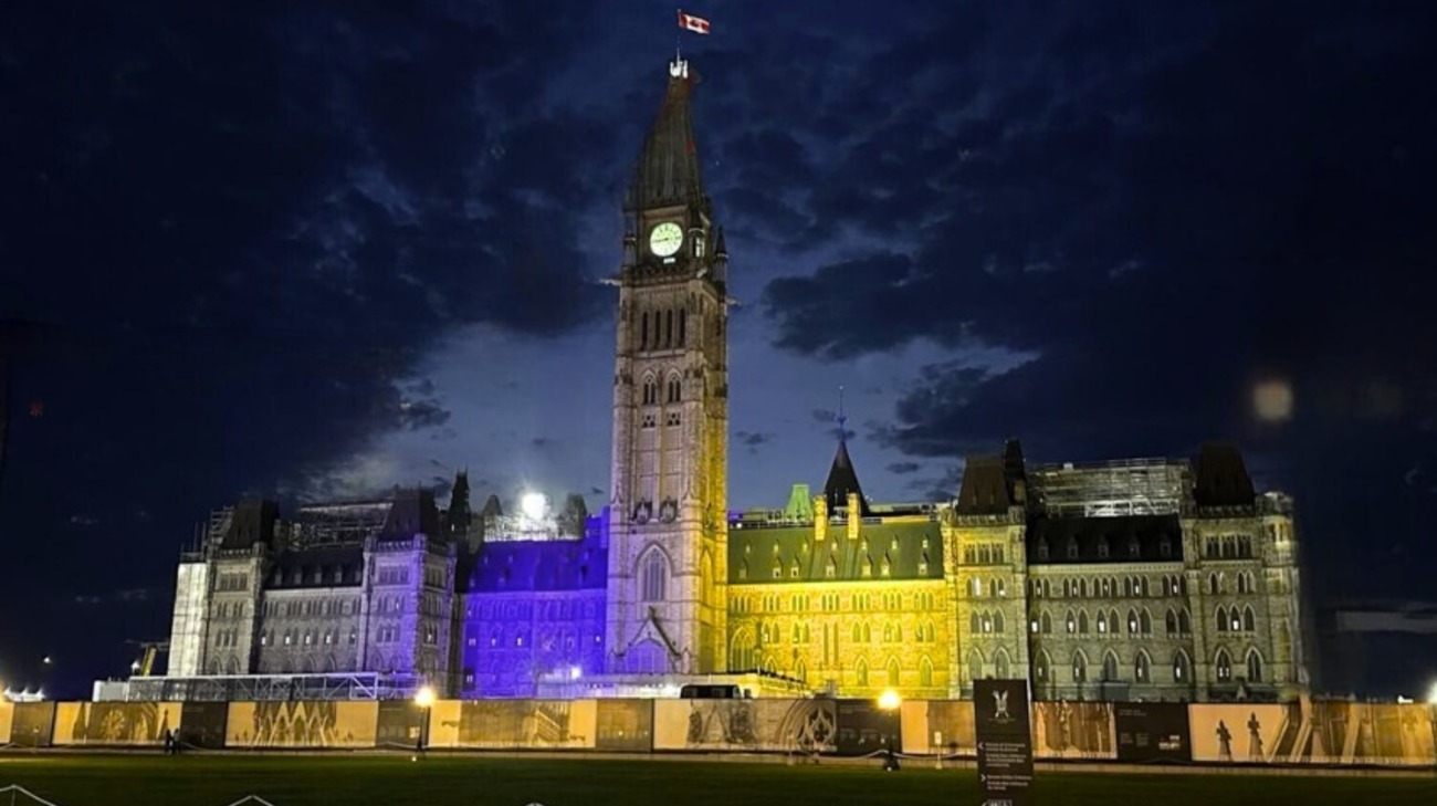 Canadian parliament lit up in blue and yellow – photos