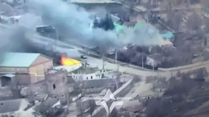 Russian volunteer soldiers fighting for Ukraine report destruction of 2 ammunition storage points in Russian town of Tyotkino – video