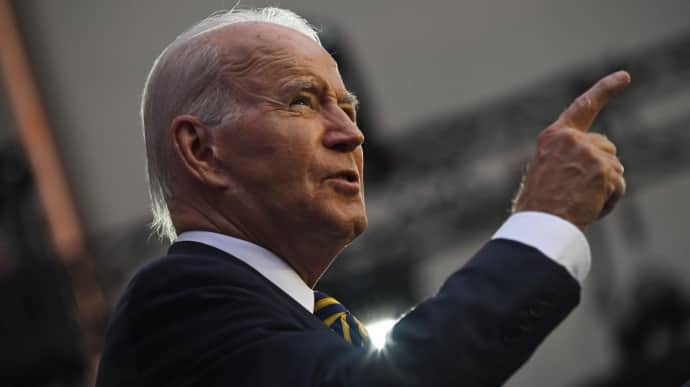 Biden signs budget into law and urges US Congress to vote for aid for Ukraine