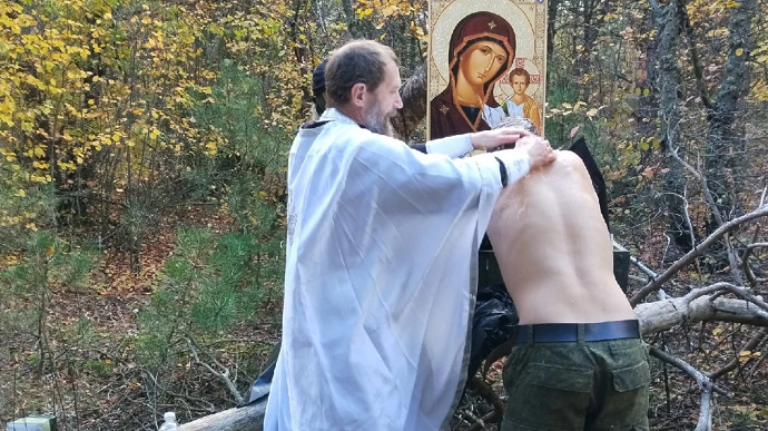 Russian priest baptises occupiers using body bags