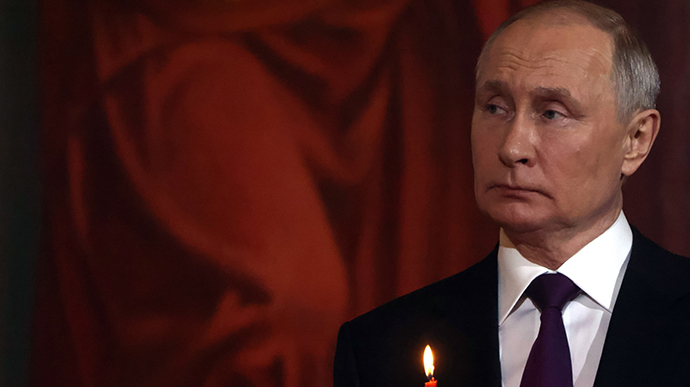 Woman sentenced for leaving a note on Putin's parents' grave asking them to take him