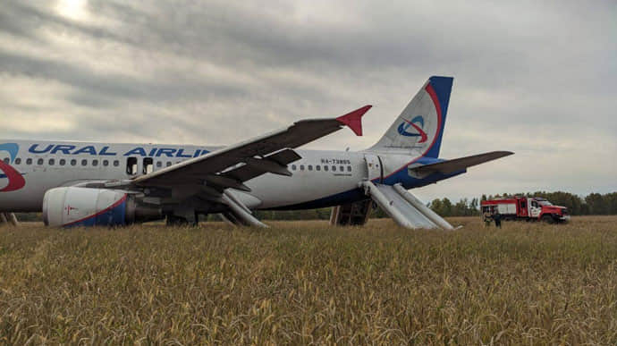 Passenger plane makes emergency landing in field in Russia