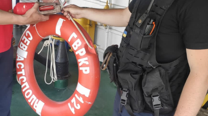 Lifebuoy and lighted buoy from sunken Moskva cruiser are pulled out of the sea